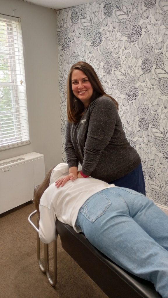 Dr. Faith Swartzendruber performing gentle chiropractic adjustment on patient at Simply Well Chiropractic in Cincinnati office