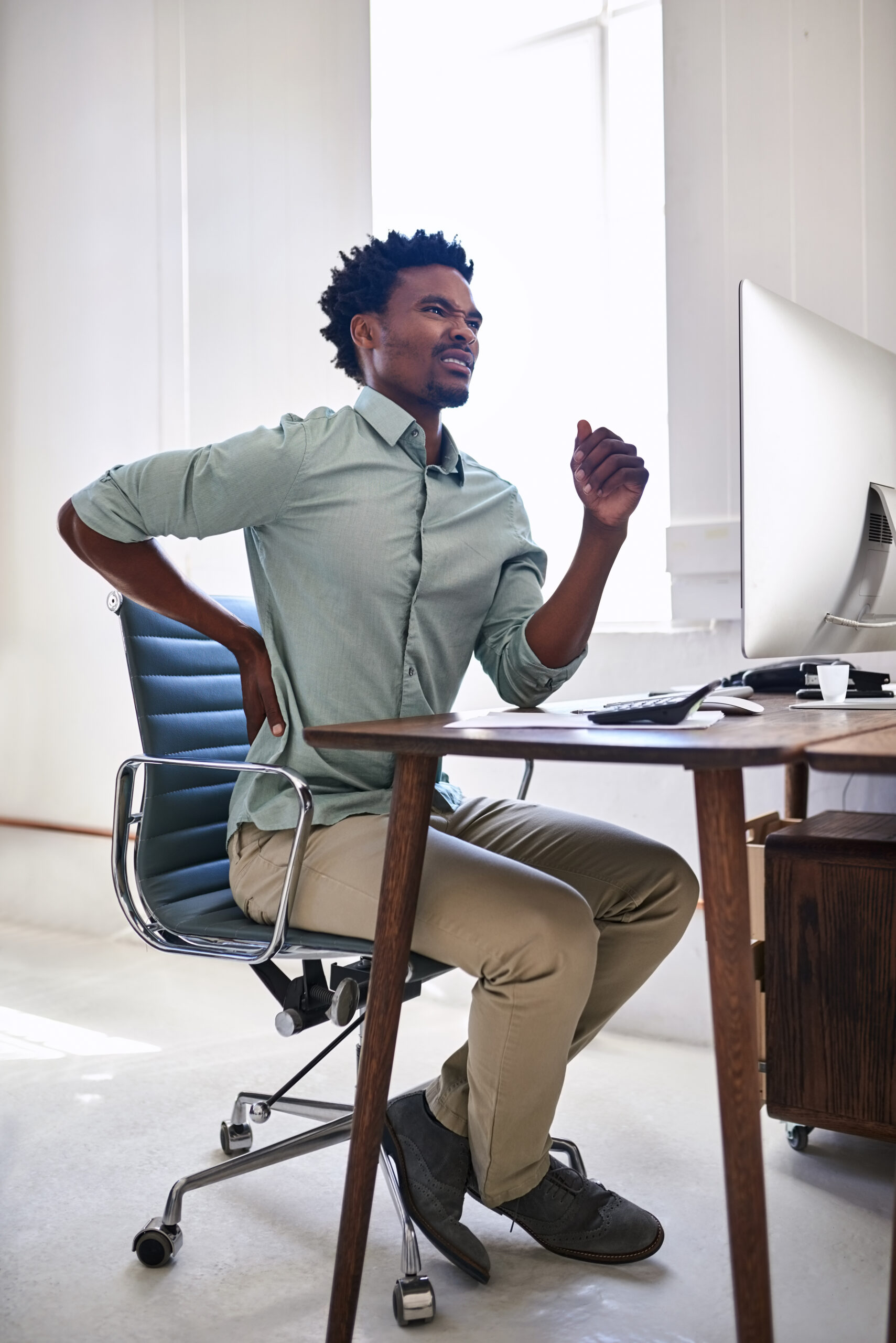 Why Does My Lower Back Hurt When I Sit or Stand Too Long?